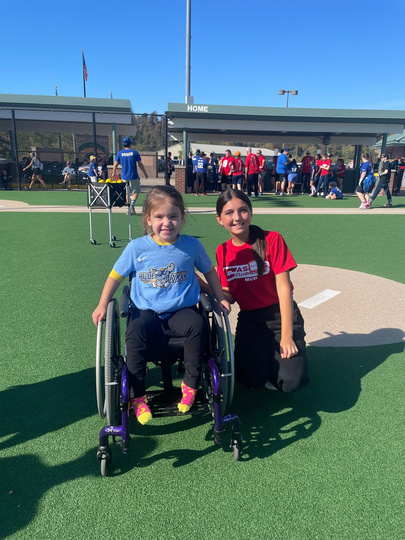 Young athletes and volunteers on the field at Casey's Clubhouse